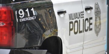 Milwaukee, WI, USA - June 11, 2023: Milwaukee Police emergency patrol vehicle in Downtown streets.