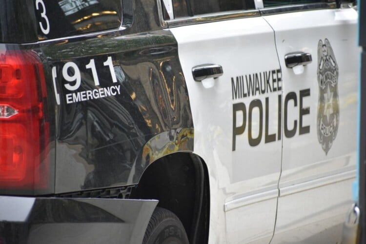 Milwaukee, WI, USA - June 11, 2023: Milwaukee Police emergency patrol vehicle in Downtown streets.