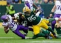 FILE - Minnesota Vikings running back Aaron Jones Sr. (33) is hit by Green Bay Packers defensive tackle Devonte Wyatt (95) during an NFL football game between the Green Bay Packers and Minnesota Vikings Nov. 23, 2025, in Green Bay, Wis. (AP Photo/Matt Ludtke, File)