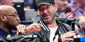 FILE - Former NFL quarterback Tony Romo, right, attends an NBA basketball game between the Indiana Pacers and the Dallas Mavericks on March 5, 2024, in Dallas. (AP Photo/Tony Gutierrez, File)