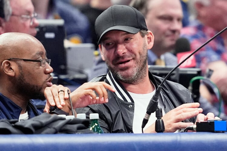 FILE - Former NFL quarterback Tony Romo, right, attends an NBA basketball game between the Indiana Pacers and the Dallas Mavericks on March 5, 2024, in Dallas. (AP Photo/Tony Gutierrez, File)