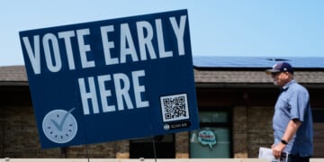 A voter walks to polling place in Milwaukee, Tuesday, July 28, 2026. (AP Photo/Nam Y. Huh)