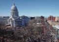 FILE - Protestors, and supporters, of Wisconsin Gov. Scott Walker's bill to eliminate collective bargaining rights for many state workers gather outside the state Capitol in Madison, Wis. on Feb. 19, 2011. (AP Photo/Andy Manis, File)