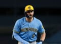 Garrett Mitchell celebrates after reaching first base at Dodger Stadium.