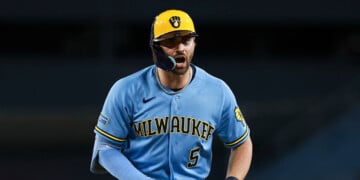 Garrett Mitchell celebrates after reaching first base at Dodger Stadium.