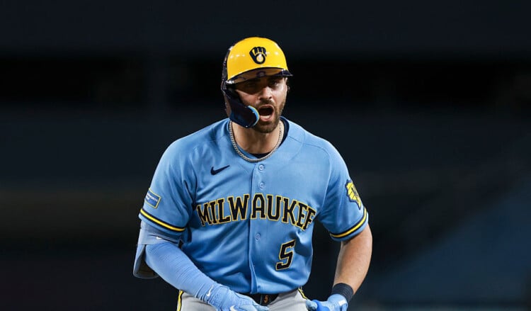 Garrett Mitchell celebrates after reaching first base at Dodger Stadium.