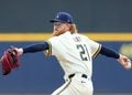 Dustin May throws a pitch at American Family Field.