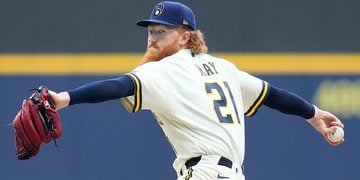 Dustin May throws a pitch at American Family Field.