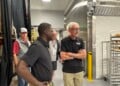 Tony Evers and David Crowley help make cream puffs