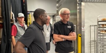 Tony Evers and David Crowley help make cream puffs