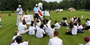 Former Green Bay Packers wide receiver Jordy Nelson (front right) and Bank of America Wisconsin president Drew Slocum (front left) speak to the youth participants before the golf clinic on Monday, August 10, 2026. (Neil Doyle/WTMJ)