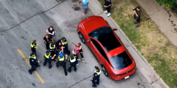 Drone video shows a struggle between Madison officers and the city's independent police monitor. Image courtesy of Madison Police Department