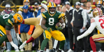 GREEN BAY, WISCONSIN - NOVEMBER 24: Running back Josh Jacobs #8 of the Green Bay Packers runs the ball during the first half of an NFL football game against the San Francisco 49ers at Lambeau Field on November 24, 2024 in Green Bay, Wisconsin. (Photo by Todd Rosenberg/Getty Images)