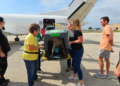 Volunteers unload pets at Milwaukee Airport, August 4, 2026