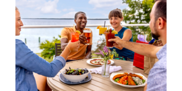 Friends Cheers Over Food In Downtown Bayfield (Photo: Travel Wisconsin)