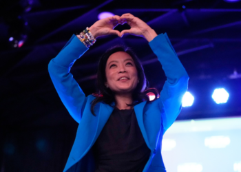 Democratic gubernatorial candidate Francesca Hong makes a heart gesture to supporters after speaking during a primary election night watch party Tuesday, Aug. 11, 2026, in Madison, Wis. (AP Photo/Nam Y. Huh)