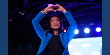 Democratic gubernatorial candidate Francesca Hong makes a heart gesture to supporters after speaking during a primary election night watch party Tuesday, Aug. 11, 2026, in Madison, Wis. (AP Photo/Nam Y. Huh)