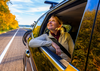 Woman Smile From Car Window Traveling Down Scenic Road In Pepin County (Photo: Travel Wisconsin)