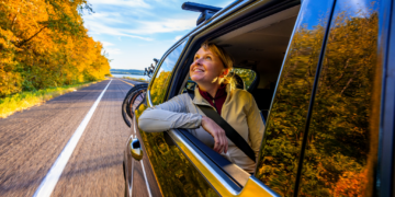 Woman Smile From Car Window Traveling Down Scenic Road In Pepin County (Photo: Travel Wisconsin)