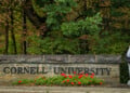 A student walks past a Cornell University sign in Ithaca, N.Y., Monday, Sept. 28, 2026. (AP Photo/Heather Ainsworth)