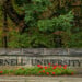 A student walks past a Cornell University sign in Ithaca, N.Y., Monday, Sept. 28, 2026. (AP Photo/Heather Ainsworth)