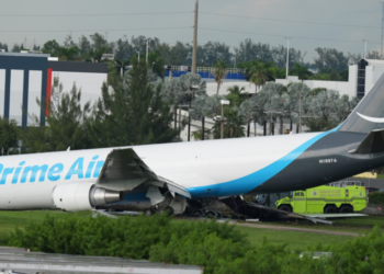 An Amazon cargo plane sits at the Miami International Airport (MIA) after it overshot the runway, Sunday, Sept. 6, 2026. (AP Photo/Lynne Sladky)