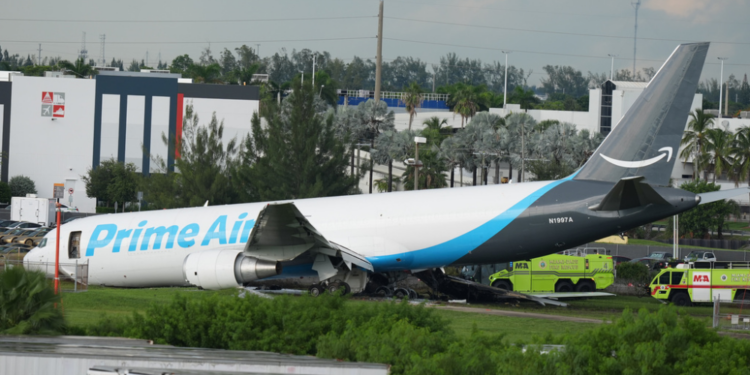 An Amazon cargo plane sits at the Miami International Airport (MIA) after it overshot the runway, Sunday, Sept. 6, 2026. (AP Photo/Lynne Sladky)