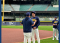 Christian Yelich talks to coaching staff ahead of the Brewers NLDS team practice, September 29, 2026. (Photo: Elisabeth Montemurro)