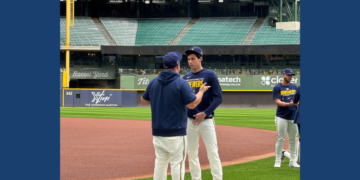 Christian Yelich talks to coaching staff ahead of the Brewers NLDS team practice, September 29, 2026. (Photo: Elisabeth Montemurro)