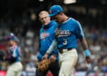 Milwaukee Brewers' Joey Ortiz exits the field with a trainer after suffering an injury during the eighth inning of a baseball game against the St. Louis Cardinals, Friday, Sept. 25, 2026, in Milwaukee. (AP Photo/Aaron Gash)