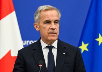 Canadian Prime Minister Mark Carney delivers a speech in the hemicycle of the European Parliament in Strasbourg, eastern France, as part of a trip during which he welcomed a proposal by European Commission President for Canada to become the EU's first associate member, on September 17, 2026. Canadian Prime Minister Mark Carney on September 17, 2026, rejected threats by US President Donald Trump over Ottawa's push for closer ties with the European Union. (Photo by Jean-Christophe VERHAEGEN / AFP via Getty Images)