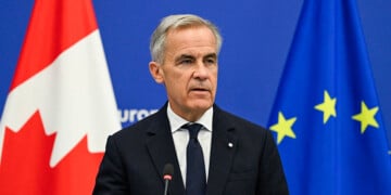 Canadian Prime Minister Mark Carney delivers a speech in the hemicycle of the European Parliament in Strasbourg, eastern France, as part of a trip during which he welcomed a proposal by European Commission President for Canada to become the EU's first associate member, on September 17, 2026. Canadian Prime Minister Mark Carney on September 17, 2026, rejected threats by US President Donald Trump over Ottawa's push for closer ties with the European Union. (Photo by Jean-Christophe VERHAEGEN / AFP via Getty Images)