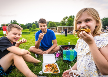 Children Eating Pizza in Lawn at The Stone Barn in Nelson (Photo: Travel Wisconsin)