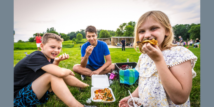 Children Eating Pizza in Lawn at The Stone Barn in Nelson (Photo: Travel Wisconsin)