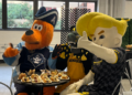 Milwaukee Admirals, UWM Panthers, and Milwaukee Wave mascots Roscoe, Pounce, and Brad Beach try the new food offerings at UW Milwaukee Panther arena, September 10, 2026. (Photo: Elisabeth Montemurro)