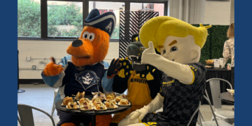 Milwaukee Admirals, UWM Panthers, and Milwaukee Wave mascots Roscoe, Pounce, and Brad Beach try the new food offerings at UW Milwaukee Panther arena, September 10, 2026. (Photo: Elisabeth Montemurro)