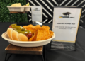 A Jalepeno and cheddar brat with herb cream cheese, a new food offering at the UW-Milwaukee Panther Arena for 2026. (Photo: Elisabeth Montemurro, September 10, 2026)