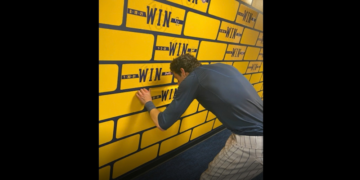 Lori Nickel shares story behind Brewers’ clubhouse win wall