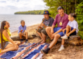 Family Listens To Flute Music On The Beach At Frog Bay Tribal National Park Apostle Islands (Photo: Travel Wisconsin)