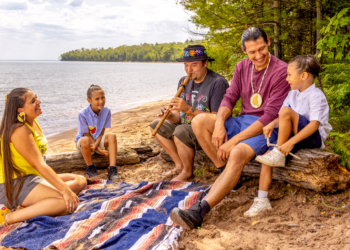 Family Listens To Flute Music On The Beach At Frog Bay Tribal National Park Apostle Islands (Photo: Travel Wisconsin)