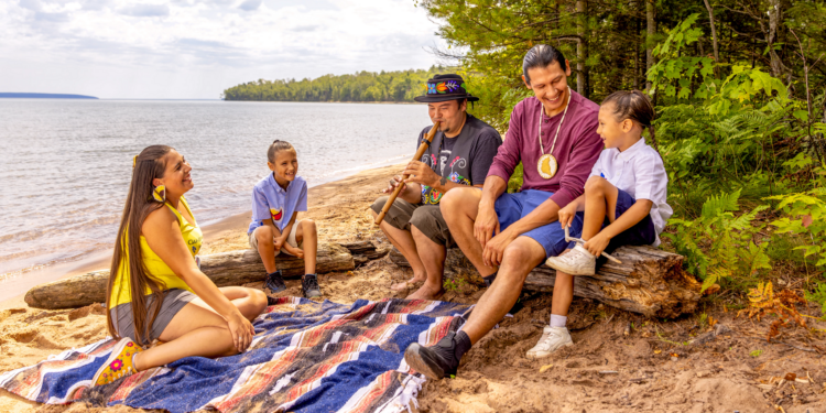 Family Listens To Flute Music On The Beach At Frog Bay Tribal National Park Apostle Islands (Photo: Travel Wisconsin)
