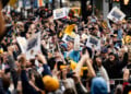 Fans cheer as the Brewers bus passes them along the Championship Parade Route (Photo: Nick Brown)