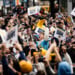 Fans cheer as the Brewers bus passes them along the Championship Parade Route (Photo: Nick Brown)