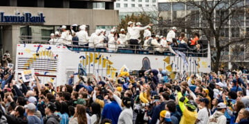 Brewers players wave to fans on top of their bus along the World Series Parade Route, October 30, 2026 (Photo: Nick Brown)