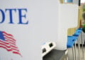 A voter cast a ballot on the first day of early voting in Minnesota at the Elections & Voter Services building, Friday, Sept. 18, 2026, in Minneapolis. (AP Photo/Ellen Schmidt)