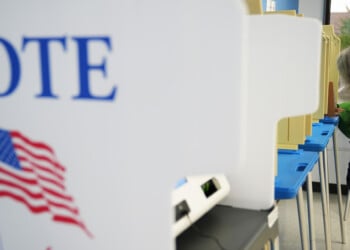 A voter cast a ballot on the first day of early voting in Minnesota at the Elections & Voter Services building, Friday, Sept. 18, 2026, in Minneapolis. (AP Photo/Ellen Schmidt)