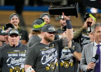 Milwaukee Brewers first baseman Jake Bauers hols the NLCS MVP trophy after Game 4 of baseball's National League Championship Series between the Milwaukee Brewers and the Los Angeles Dodgers, Thursday, Oct. 15, 2026, in Los Angeles. (AP Photo/Ashley Landis)