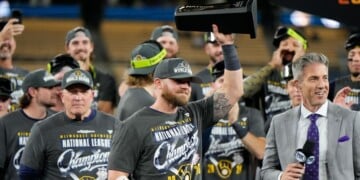 Milwaukee Brewers first baseman Jake Bauers hols the NLCS MVP trophy after Game 4 of baseball's National League Championship Series between the Milwaukee Brewers and the Los Angeles Dodgers, Thursday, Oct. 15, 2026, in Los Angeles. (AP Photo/Ashley Landis)