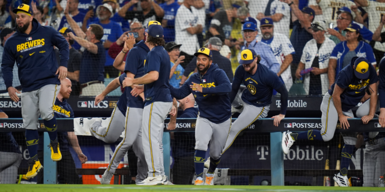 The Milwaukee Brewers celebrates after the final out of Game 4 of baseball's National League Championship Series between the Milwaukee Brewers and the Los Angeles Dodgers, Thursday, Oct. 15, 2026, in Los Angeles. (AP Photo/Gregory Bull)