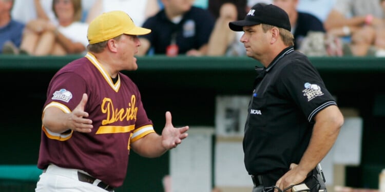 FILE - Arizona State coach Pat Murphy, left, protests to home plate umpire Jeff Henrichs after a balk call allowed UC Irvine's Taylor Holiday to score in the fourth inning of a College World Series baseball elimination game in Omaha, Neb., June 19, 2007. (AP Photo/Eric Francis, File)